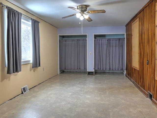 unfurnished room featuring ceiling fan