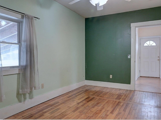 entrance foyer featuring ceiling fan, light hardwood / wood-style flooring, and a healthy amount of sunlight