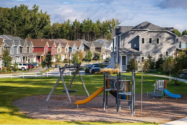 view of jungle gym featuring a lawn