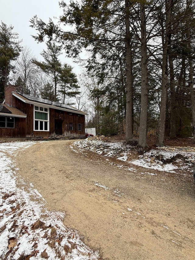 exterior space featuring dirt driveway