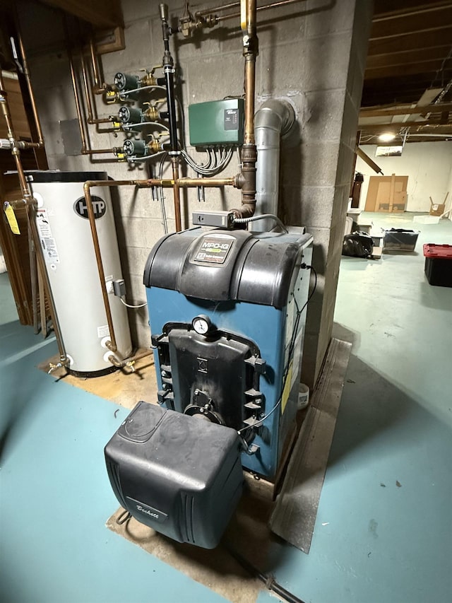 utility room featuring water heater