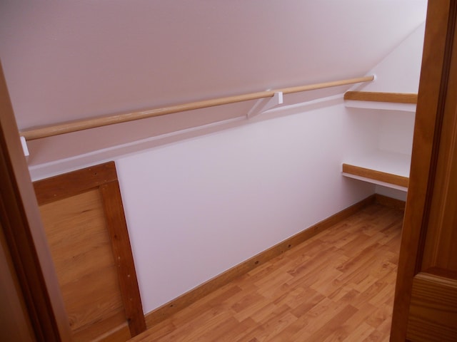 walk in closet featuring light hardwood / wood-style floors