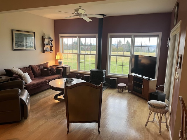 living room with ceiling fan, a healthy amount of sunlight, and light hardwood / wood-style floors