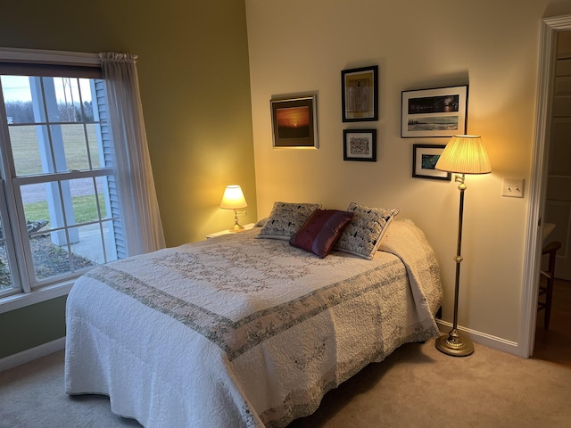 carpeted bedroom featuring access to outside