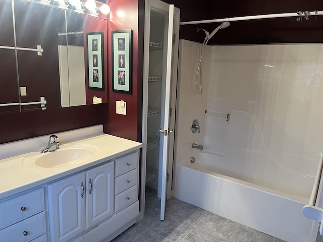 bathroom with vanity, tile patterned floors, and shower / washtub combination