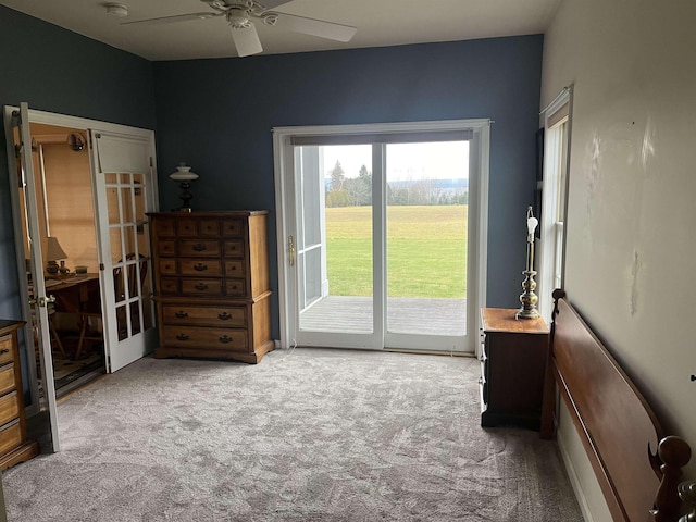 interior space with access to exterior, light carpet, french doors, and ceiling fan