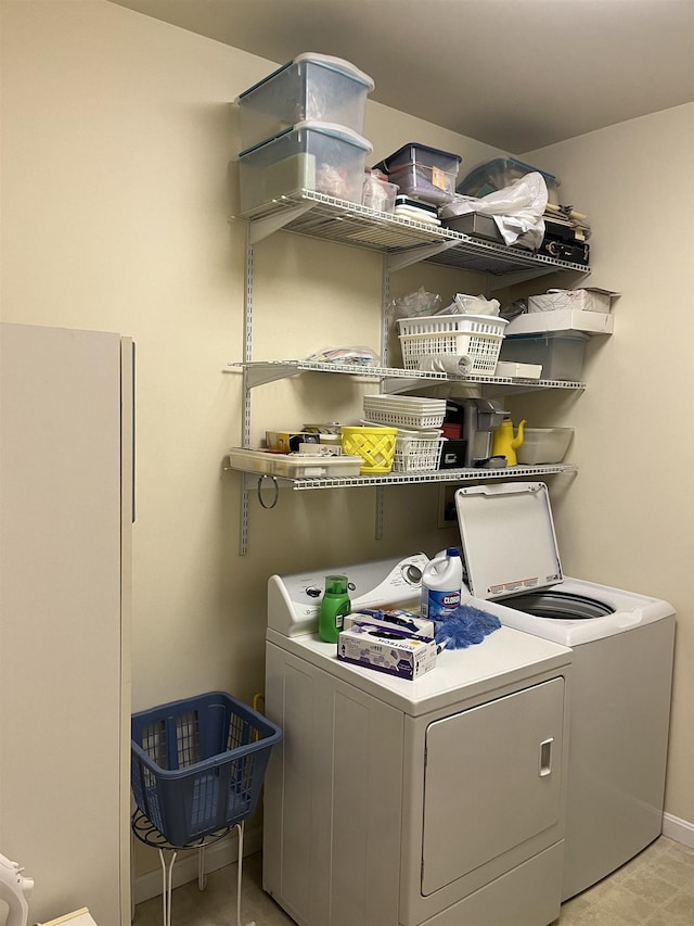 clothes washing area featuring independent washer and dryer