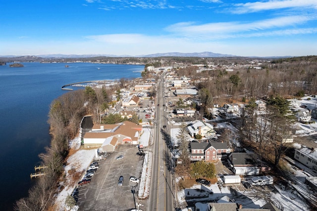 drone / aerial view featuring a water and mountain view