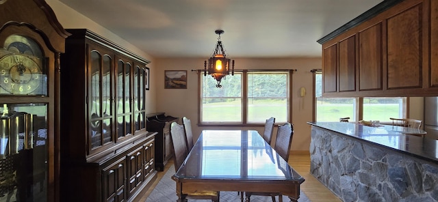 dining room featuring light hardwood / wood-style flooring and an inviting chandelier