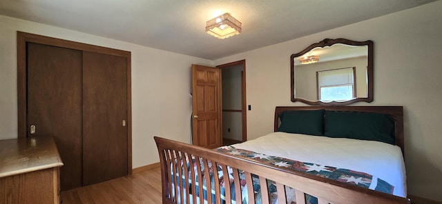 bedroom featuring a closet and light hardwood / wood-style flooring