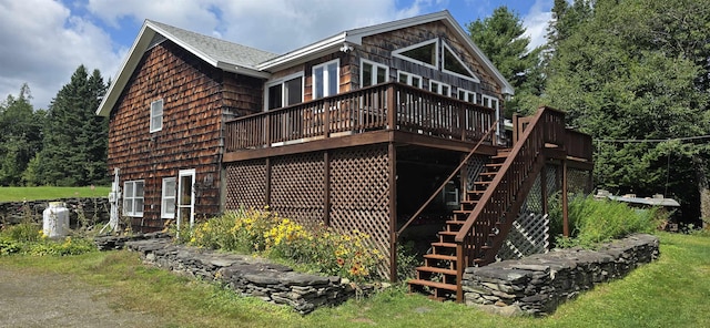 view of property exterior featuring a wooden deck