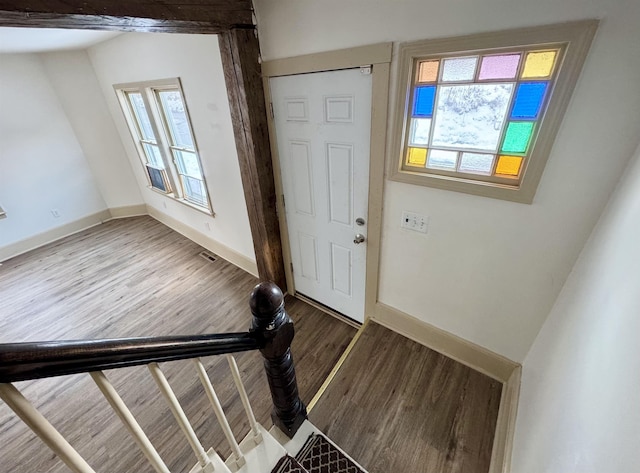 doorway with hardwood / wood-style flooring