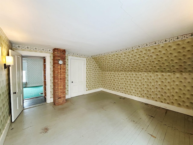 bonus room with wood-type flooring