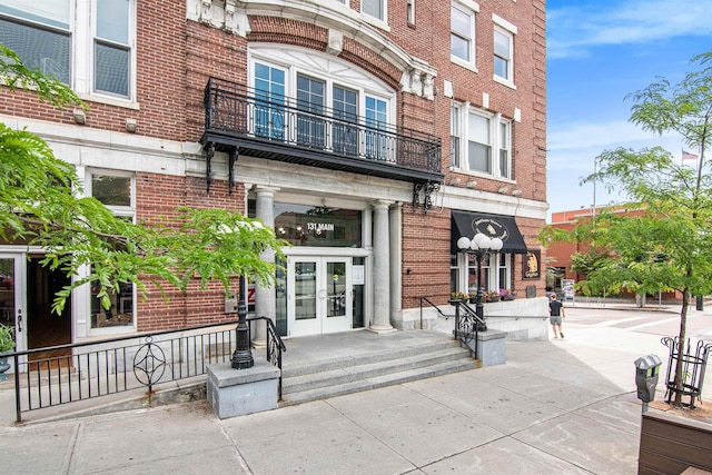 doorway to property with french doors and a balcony