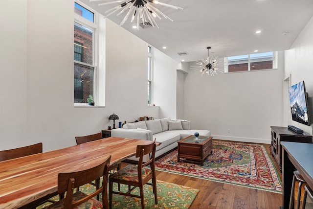 131 Main St Unit 2A-1, Burlington, VT 05401 - living room with a chandelier, wood finished floors, and recessed lighting