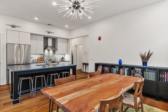 131 Main St Unit 2A-1, Burlington, VT 05401 - dining area with light wood-style flooring, a chandelier, and recessed lighting