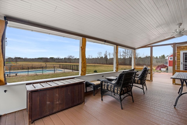 wooden terrace with an outdoor living space, ceiling fan, and a swimming pool