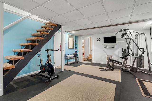 exercise room featuring a paneled ceiling