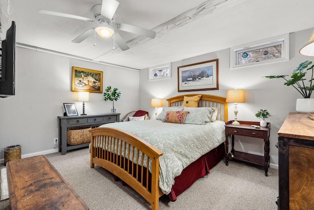 bedroom featuring ceiling fan and light carpet