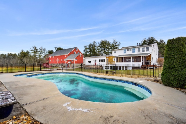 view of pool with a patio and a sunroom