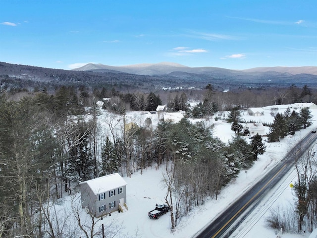 snowy aerial view with a mountain view