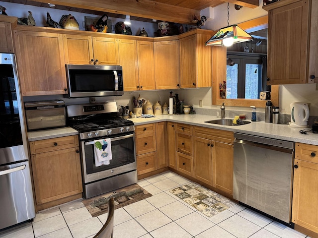 kitchen with sink, light tile patterned floors, appliances with stainless steel finishes, beamed ceiling, and decorative light fixtures