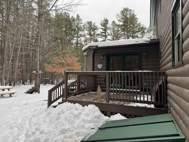 view of snow covered deck