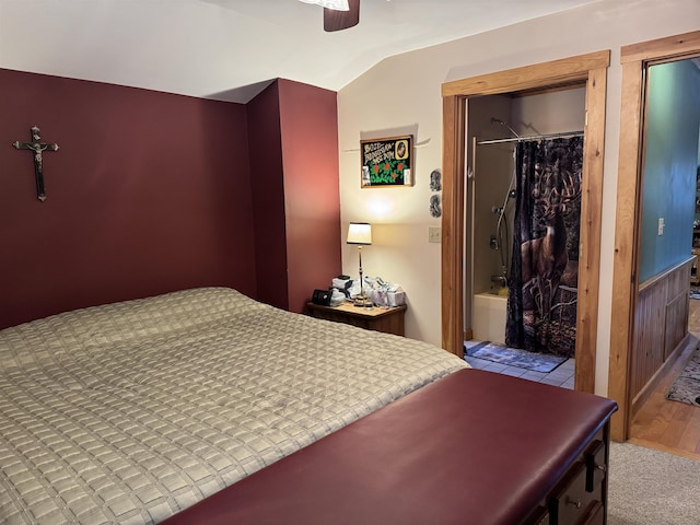 bedroom with ceiling fan, light wood-type flooring, lofted ceiling, and a closet