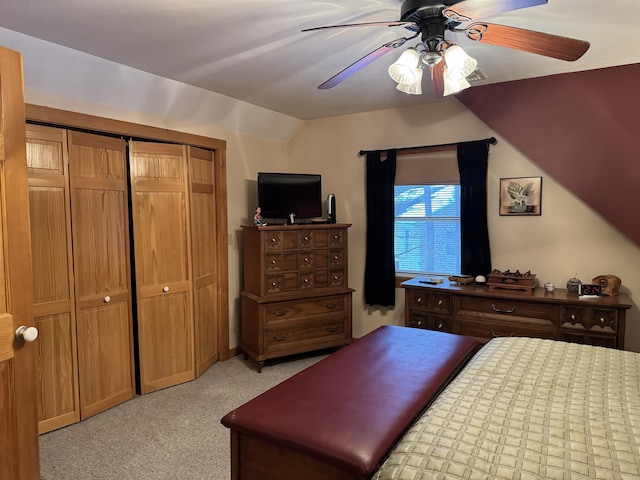 carpeted bedroom featuring ceiling fan and a closet