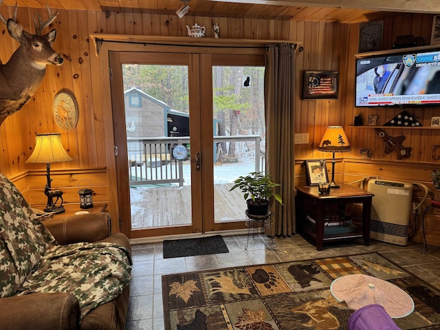 doorway to outside with wood walls, french doors, and wooden ceiling