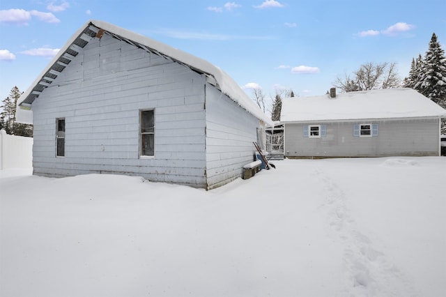 view of snow covered house