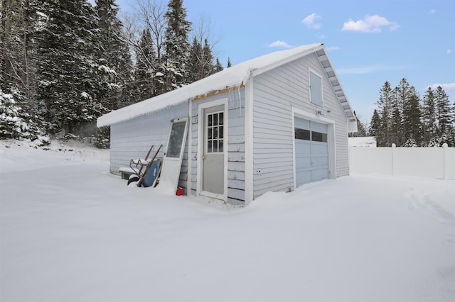 view of snow covered garage