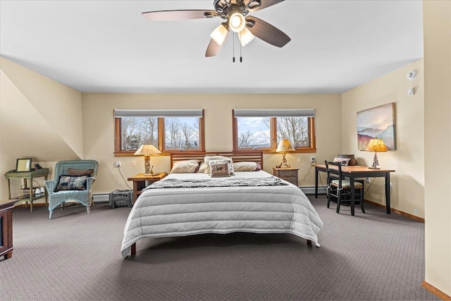 carpeted bedroom with ceiling fan and a baseboard radiator