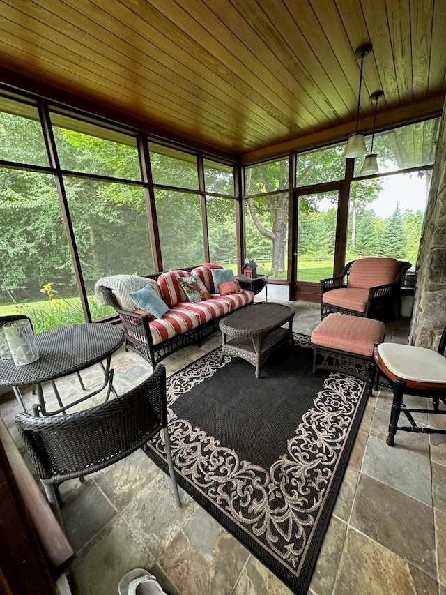 sunroom / solarium featuring wooden ceiling