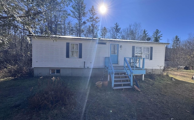 manufactured / mobile home with a wooden deck