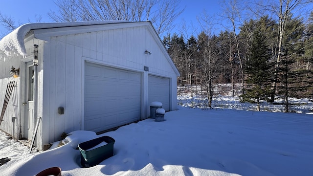 view of snow covered garage