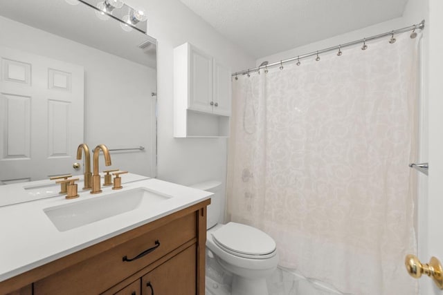 bathroom featuring vanity, toilet, and curtained shower