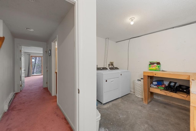 washroom with washer and dryer, a textured ceiling, and a baseboard heating unit