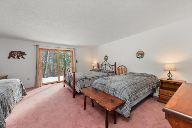 bedroom with access to outside, carpet floors, and a textured ceiling