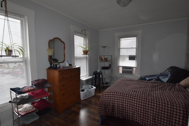 bedroom featuring multiple windows and crown molding