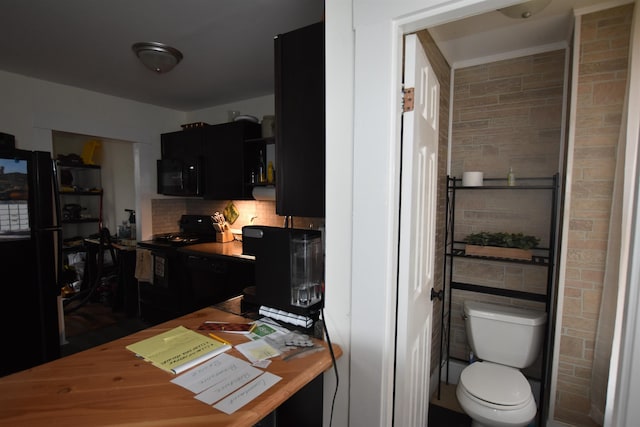 kitchen with backsplash and black appliances