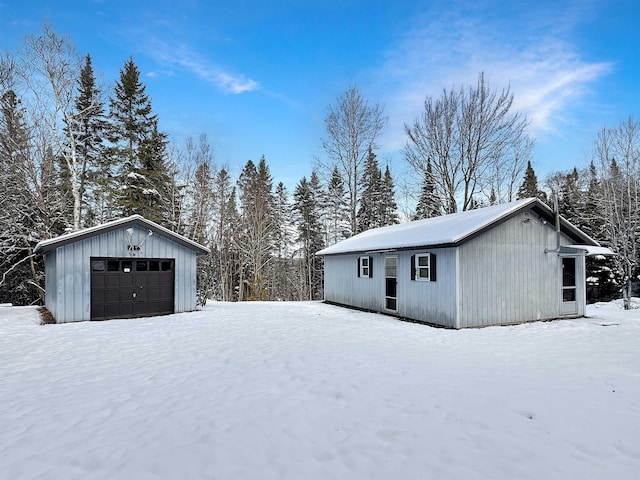 exterior space featuring an outdoor structure and a garage