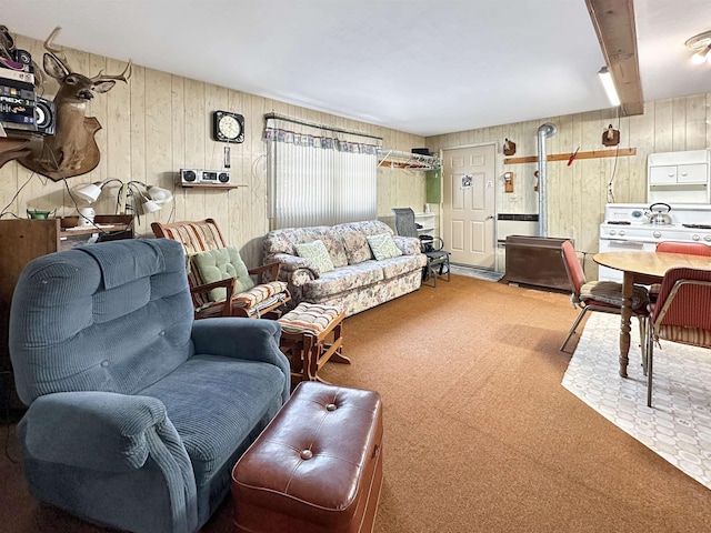 living room with carpet and beamed ceiling