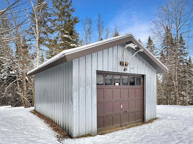 view of snow covered garage