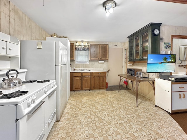 kitchen featuring sink and white stove