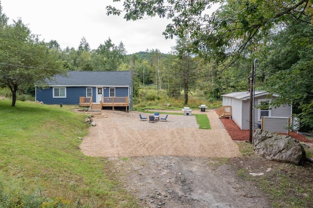 exterior space featuring a lawn and a wooden deck