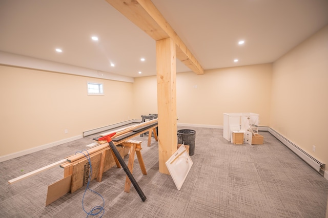 playroom with baseboard heating and light carpet