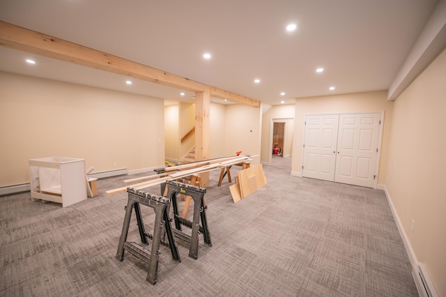 game room with light colored carpet and a baseboard radiator