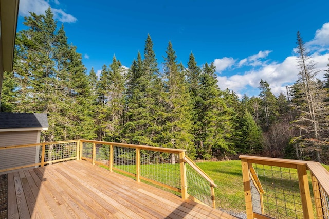 wooden deck with a lawn