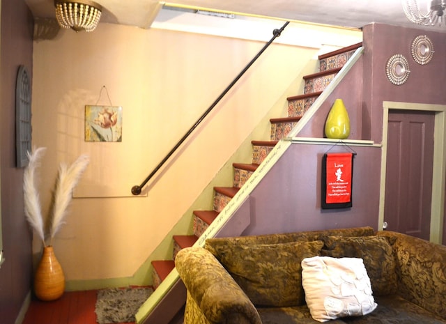 stairs featuring hardwood / wood-style floors